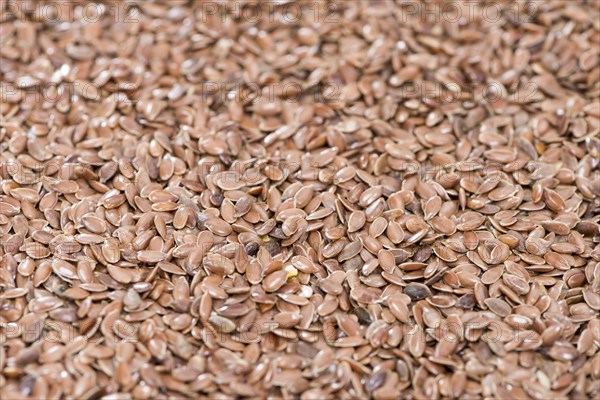 Detailed close-up shot of brown Linseeds for use as background or texture