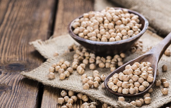 Portion of dried Chick Peas on an old wooden table