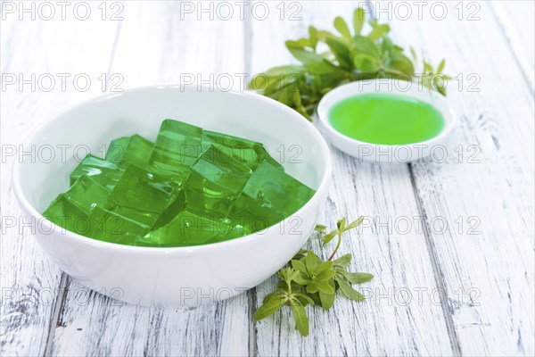 Fresh made Woodruff Jello (close-up shot) on wooden background