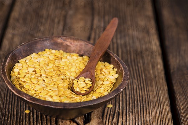 Portion of raw yellow Lentils (detailed close-up shot)