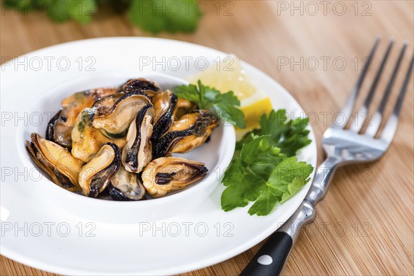 Pickled Mussels (with fresh herbs) as detailed close-up shot