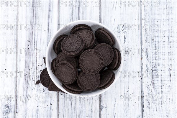 Cream Cookies (close-up shot) on wooden background