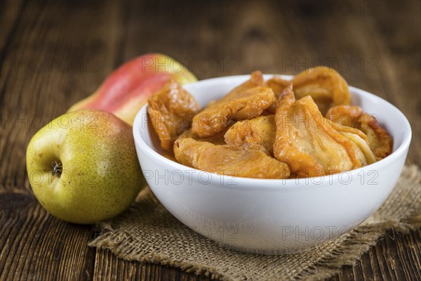 Some dried Pears (selective focus, close-up shot) on wooden background