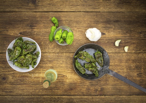 Pimientos de Padron on a vintage background as detailed close-up shot, selective focus