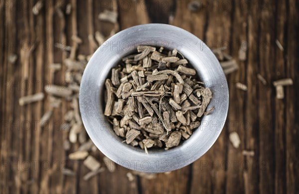 Valerian Roots on a wooden table (detailed close-up shot)
