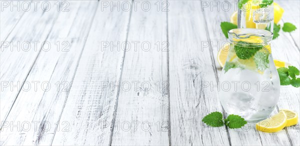 Lemonade on a vintage background as detailed close-up shot (selective focus)