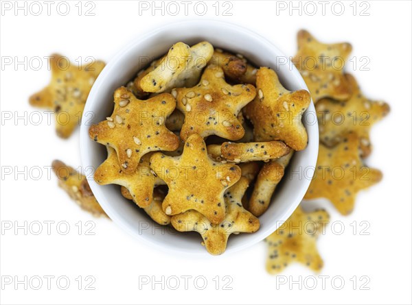 Portion of mixed Snacks isolated on white background (detailed close up shot, selective focus)