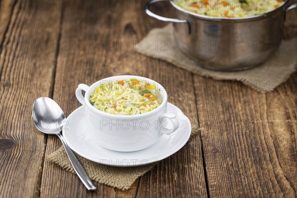 Portion of fresh made Alphabet Soup (selective focus, close-up shot)