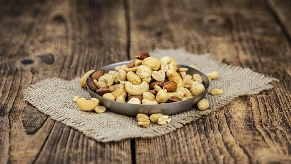 Roasted and salted nuts as detailed close up shot (selective focus)