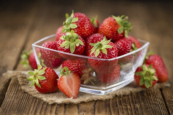 Strawberries on a vintage background as detailed close-up shot, selective focus
