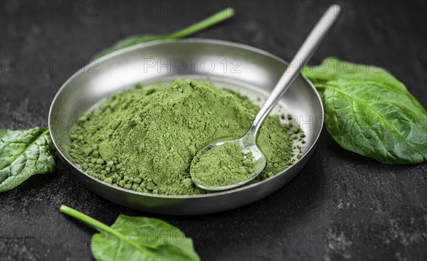 Homemade green spinach powder (close up shot, selective focus)