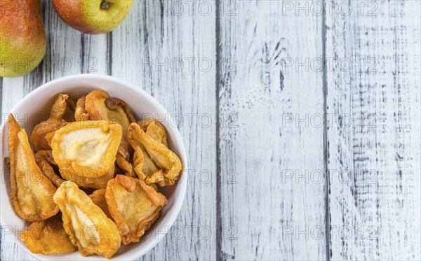 Bowl with dried Pears (close-up shot, selective focus)