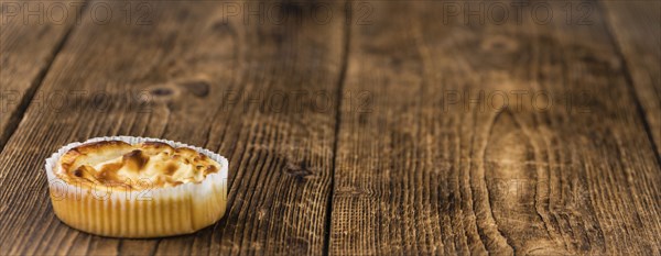 Homemade Cheesecake on vintage background (selective focus, close-up shot)
