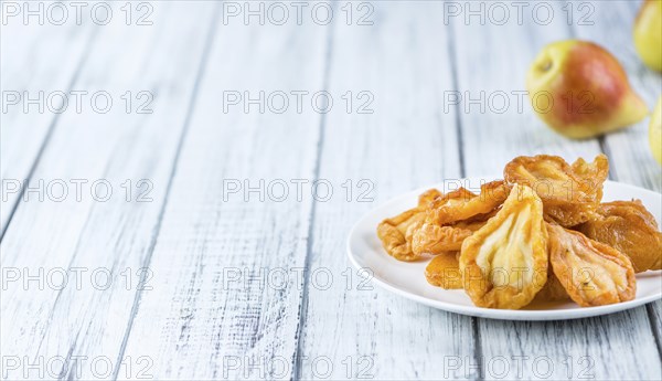 Bowl with dried Pears (close-up shot, selective focus)