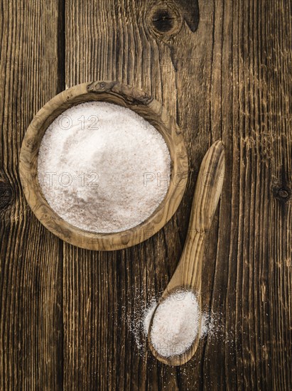 Pink Salt on a vintage background as detailed close-up shot (selective focus)