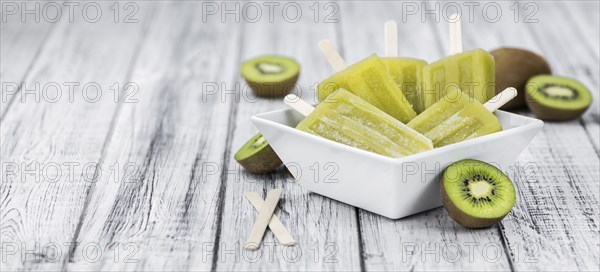 Kiwi Popsicles (fresh) as detailed close-up shot, selective focus)