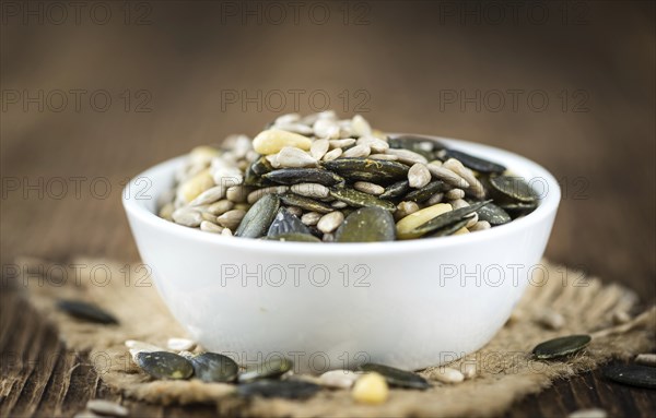 Mixed Seeds (close-up shot, selective focus) on vintage wooden background
