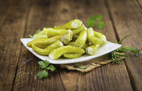 Some homemade Green Chilis (filled with cheese) (selective focus) as detailed close-up shot