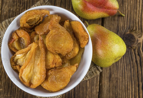 Dried Pears (selective focus) on an old wooden table