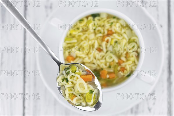 Portion of homemade Alphabet Soup (selective focus, close-up shot)
