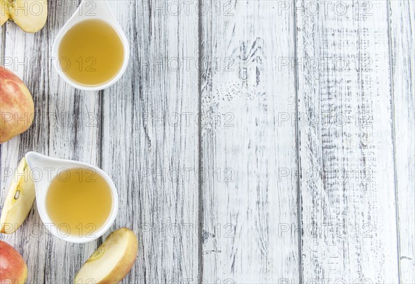 Portion of fresh made Applesauce (close-up shot) on vintage background