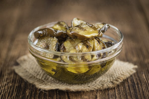 Homemade Antipasti (Grilled Zucchinis) on vintage background (selective focus, close-up shot)
