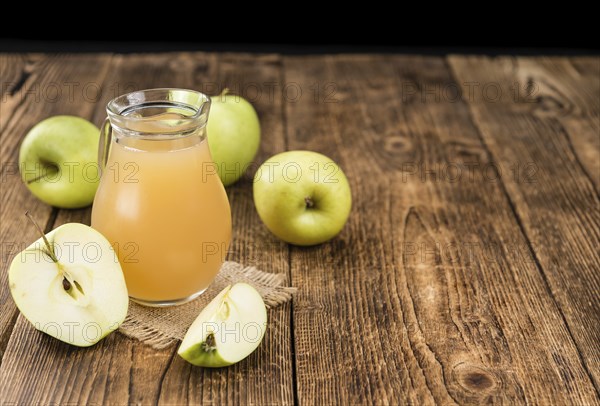 Fresh made Juice (apple) on a vintage background (close-up shot)