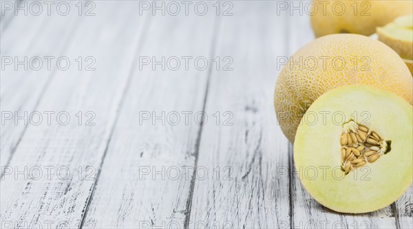 Fresh made Honeydew Melon on a vintage background (close-up shot)