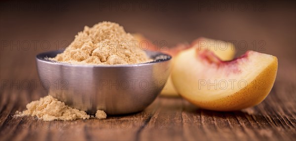 Ground Peaches on a vintage background as detailed close-up shot, selective focus
