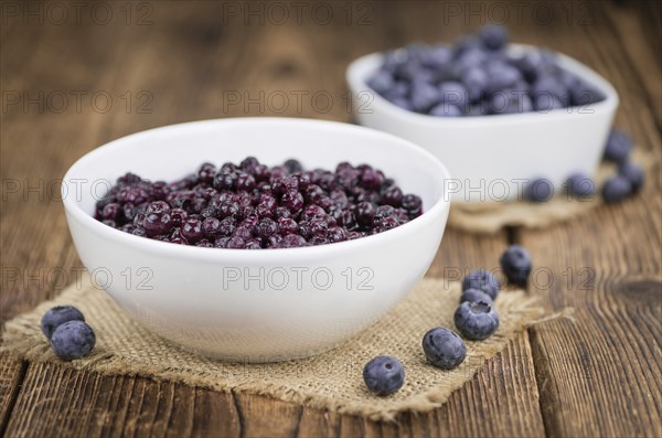 Fresh made Blueberries (preserved) on an old and rustic wooden table, selective focus, close-up