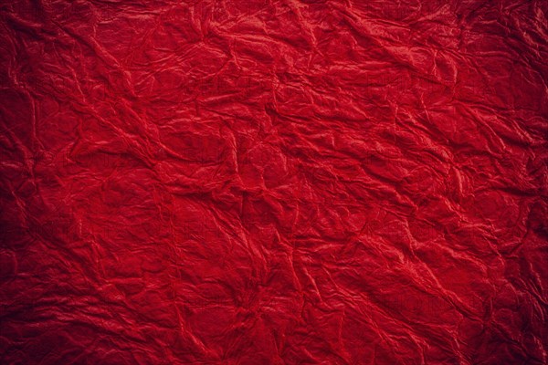 Background surface of wrinkled red and crumpled paper