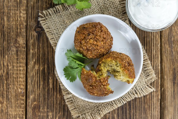 Wooden table with Falafels (close-up shot, selective focus)