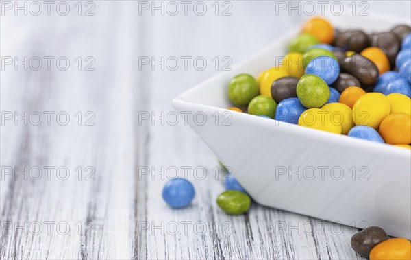Chocolate coated peanuts as detailed close up shot (selective focus)
