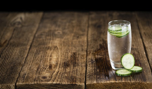 Cucumber Water on a vintage background as detailed close-up shot, selective focus