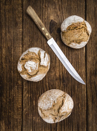 Wholemeal Roll on a vintage background as detailed close-up shot (selective focus)