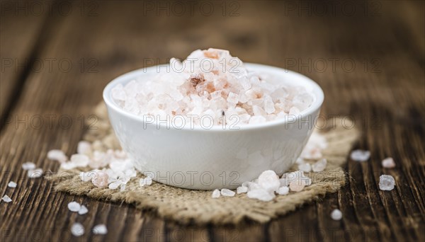 Pink Salt on a vintage background as detailed close-up shot (selective focus)