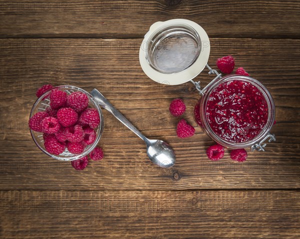 Fresh made Raspberry Jam on a vintage background as detailed close-up shot