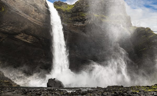 Haifoss waterfall in western Iceland at a cloudy summer day