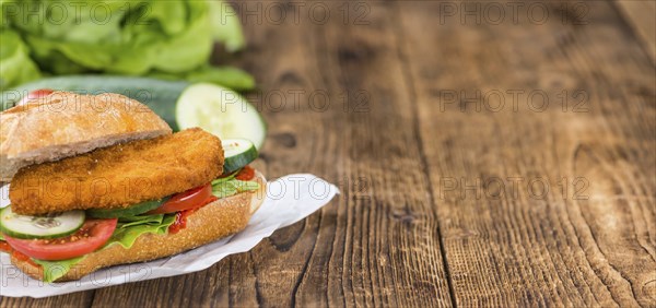 Fresh made Chicken Schnitzel on a bun (close-up shot, selective focus)