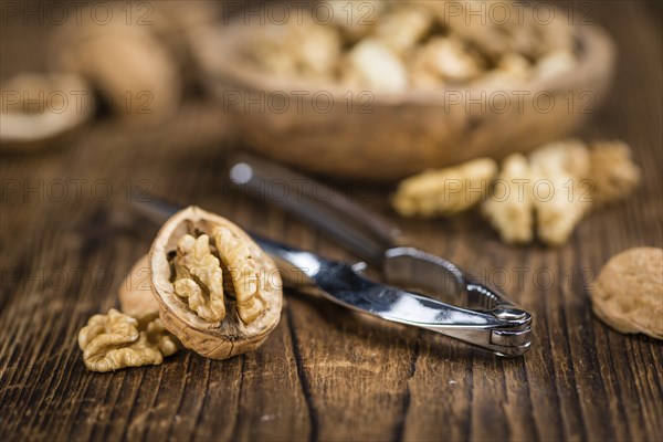 Portion of fresh Walnut kernels (close-up shot, selective focus)