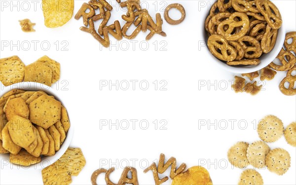 Portion of mixed Snacks isolated on white background (close up shot, selective focus)