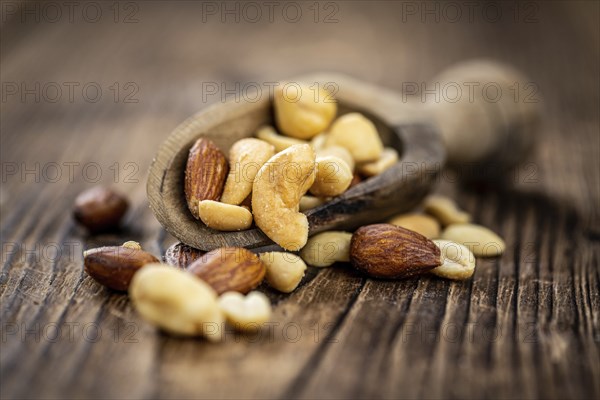 Roasted and salted nuts as detailed close up shot (selective focus)