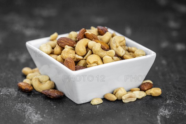 Roasted and salted nuts as detailed close up shot (selective focus)