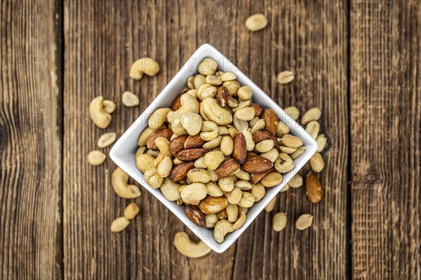 Roasted and salted nuts as detailed close up shot (selective focus)