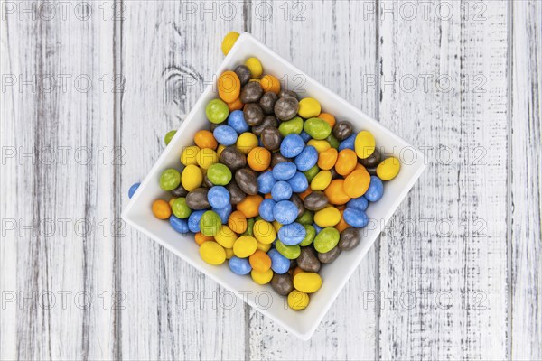 Chocolate coated peanuts as detailed close up shot (selective focus)