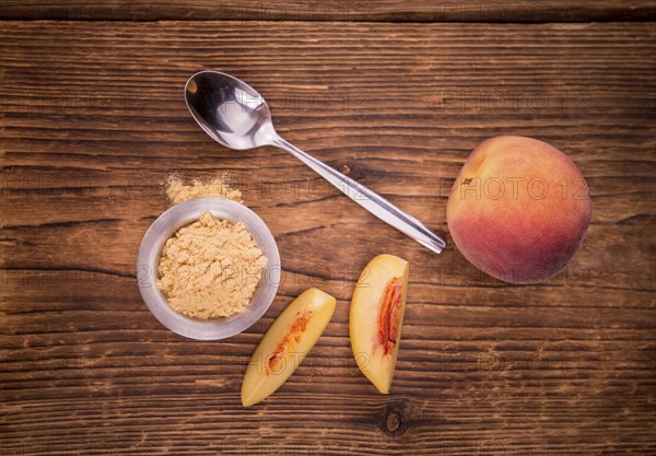Ground Peaches on a vintage background as detailed close-up shot, selective focus