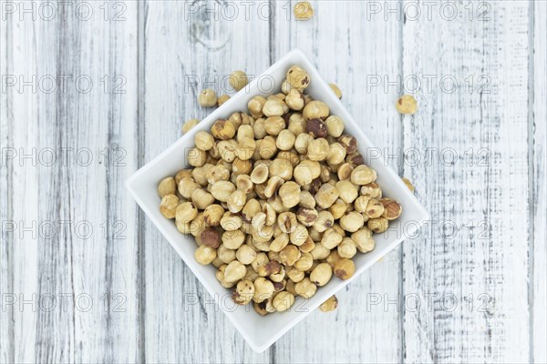 Peeled Hazelnuts as detailed close up shot (selective focus)