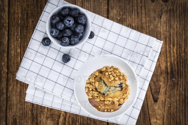 Some fresh Blueberry Muffins (selective focus, close-up shot)