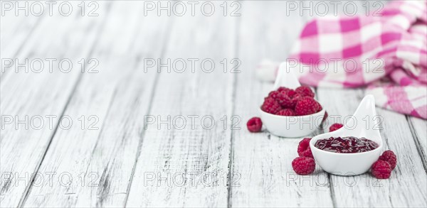 Fresh made Raspberry Jam on a vintage background as detailed close-up shot
