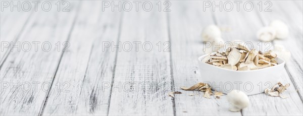 Dried white Mushrooms on a vintage background as detailed close-up shot, selective focus